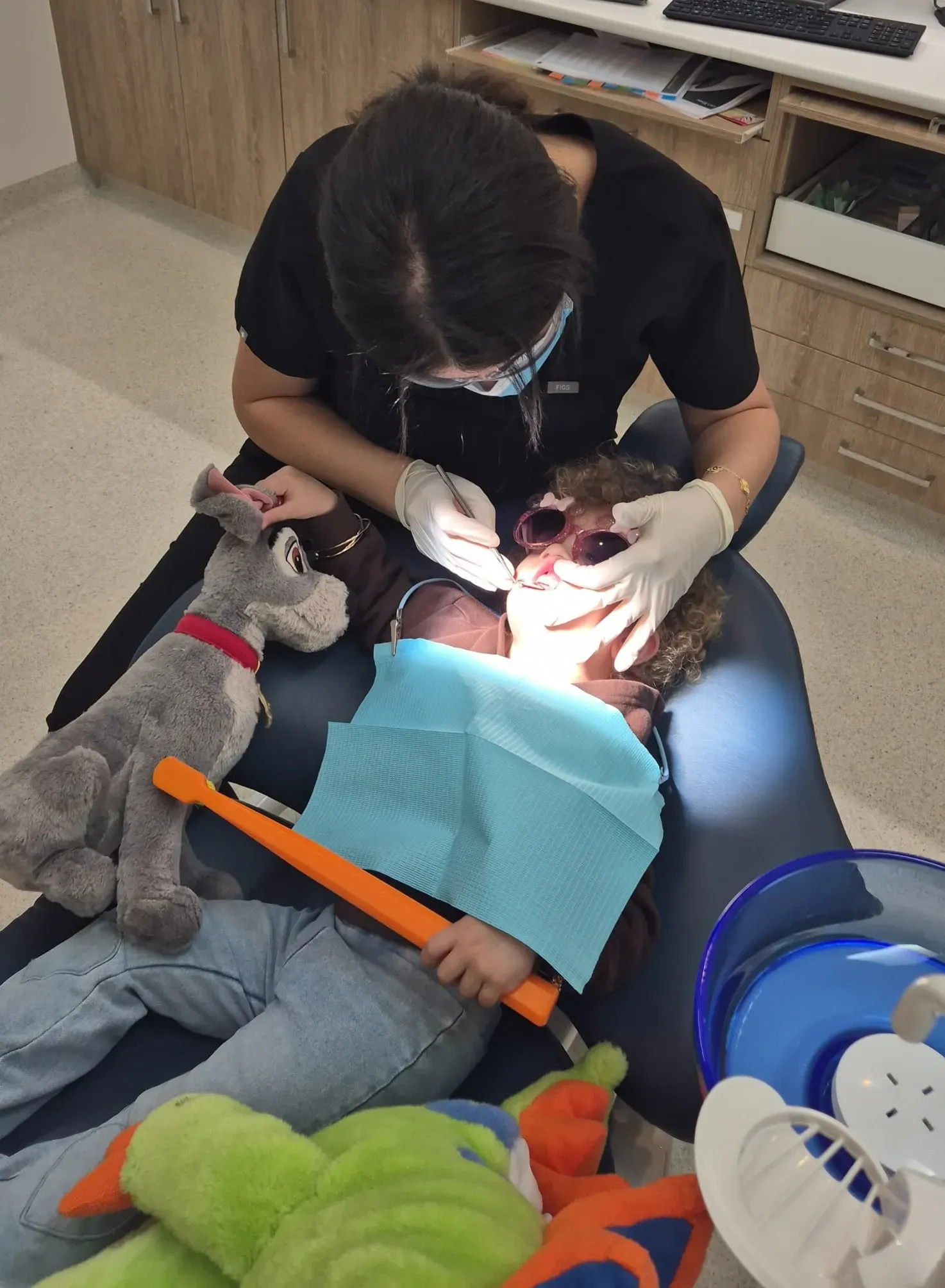 Child receiving dental treatment